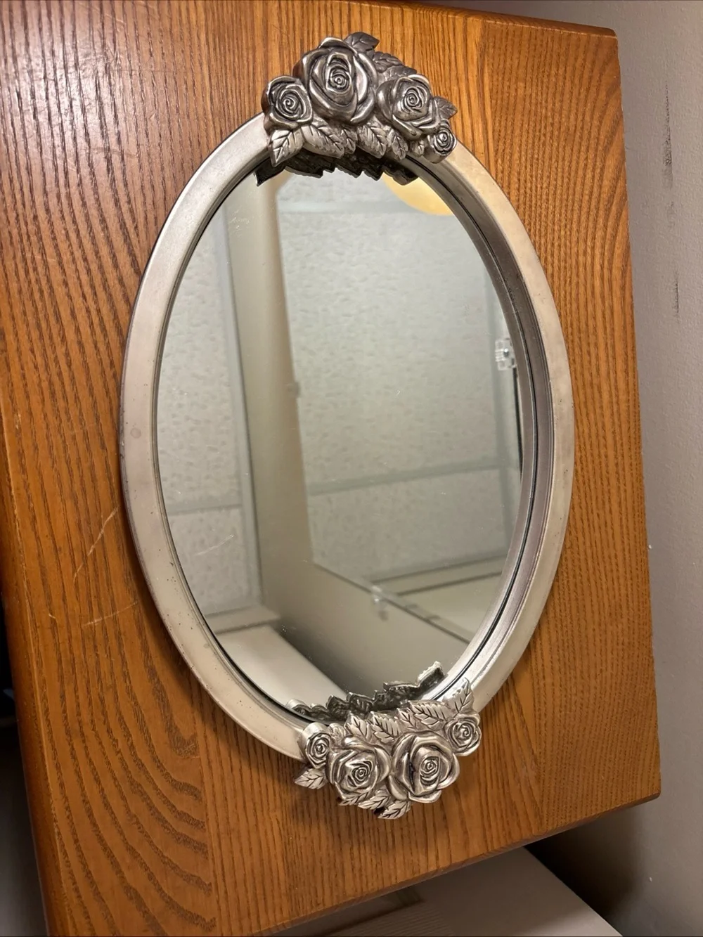 Elegant Silver Oval Wall Mirror with Rose Accents
